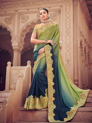 You can this amazing saree  and look pretty like never before. wearing this Olive green and Blue color two tone shaded satin fabrics saree. this gorgeous saree featuring a beautiful mix of designs. look gorgeous at an upcoming any occasion wearing the saree. Its attractive color and designer heavy embroidered design, moti design work, patch design, beautiful floral design all over in saree work over the attire & contrast hemline adds to the look. Comes along with a contrast unstitched blouse.