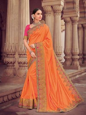Flaunt a new ethnic look wearing this orange color two tone silk saree. Ideal for party, festive & social gatherings. this gorgeous saree featuring a beautiful mix of designs. Its attractive color and designer heavy embroidered design, moti design work, patch design, beautiful floral design all over in saree work over the attire & contrast hemline adds to the look. Comes along with a contrast unstitched blouse.