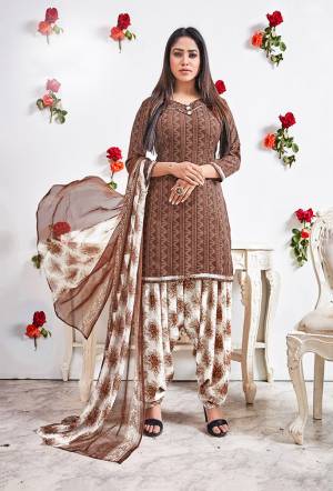 This Pretty crepe fabricated floral printed patiala style suit comes with Crepe fabricated bottom with chiffon  printed dupatta. Get This Dress Material Stitched As Per your Desired Fit And Comfort. Pair it with high heels and look effortlessly chic and fashionable.