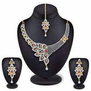 Grab This Heavy Necklace Set For The Upcoming Wedding Season In Golden And Silver Color Beautified With Diamond Work All Over. It Comes With A Pair Of Earrings And A Maang Tika. You Can Pair This Up With Any Colored Heavy Traditional Attire. 