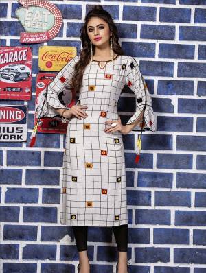 Grab This Designer Readymade Kurti In White Color Fabricated On Rayon. This Kurti Is Beautified With Thread Work And Prints. Its Fabric Ensures Superb Comfort All Day Long. 