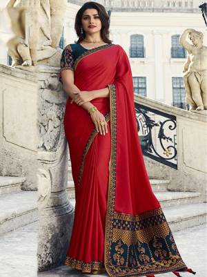 Adorn The Pretty Angelic Look Wearing This Designer Saree In Red Color Paired With Contrasting Teal Blue Colored Blouse. This Saree Is Fabricated On Georgette And Jacquard Silk Paired With Art Silk Fabricated Blouse. It Has Attractive Embroidered Border And Blouse. Buy Now.
