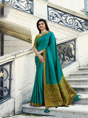 New Color Pallete IS Here With This Designer Saree In Blue Color Paired With Contrasting Olive Green Colored Blouse. This Saree Is Fabricated On Georgette And Jacquard Silk Paired With Art Silk Fabricated Blouse. It Is Light In Weight And Easy To Carry All Day Long.  Buy Now.