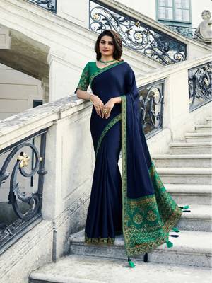 Enhance Your Personality Wearing This Elegant Looking Designer Saree In Navy Blue Color Paired With Contrasting Sea Green Colored Blouse. This Saree Is Fabricated On Georgette And Jacquard Silk Paired With Art Silk Fabricated Blouse. Buy Now.