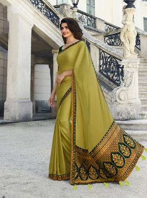 Go With The Shades Of Green With This Designer Saree In Pear Green Color Paired With Dark Green Colored Blouse. This Pretty Georgette Based Saree Is Paired With Art Silk Fabricated Blouse. It Has Attractive Embroidery Over The Pallu, Blouse And Border. 