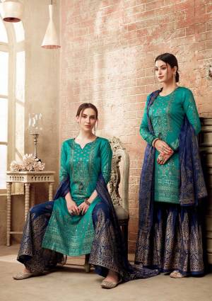 Get Ready For The Upcoming Festive And Wedding Season Wearing This Designer Straight Suit In Turquoise Blue Color Paired With Navy Blue Colored Bottom And Dupatta. Its Top Is Silk Based Paired With Cotton Bottom And Chiffon Fabricated Dupatta. Buy This Semi-Stitched Suit Now.