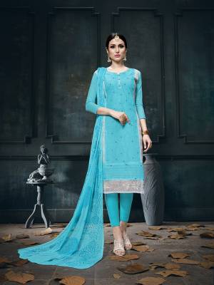 For Your Semi-Casuals, Grab This Designer Straight Suit In Blue Paired With Blue Colored Bottom And Dupatta. It Is Cotton Based Paired With Chiffon Fabricated Dupatta. Also It Has Very Pretty Jari Embroidery With Stone Work. 