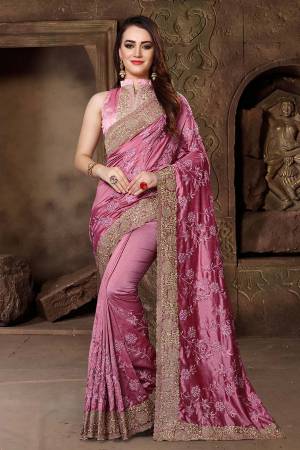 Get Ready For The Upcoming Festive And Wedding Season With This Heavy Designer Saree In Dark Pink Color Paired With Dark Pink Colored Blouse. This Saree Is Fabricated In Art Silk Paired With Satin Silk Fabricated Blouse. Its Heavy Embroidery And Rich Fabric Will Earn You Lots Of Compliments From Onlookers. 