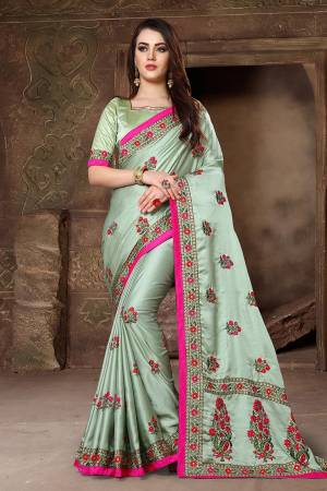 Flaunt Your Rich And Elegant Taste Wearing This Designer Saree In Light Green Color Paired With Light Green Colored Blouse. This Saree And Blouse Are Fabricated On Satin Silk Beautified With Heavy Resham And Jari Work. It Is Suitable For All Occasion Wear. 