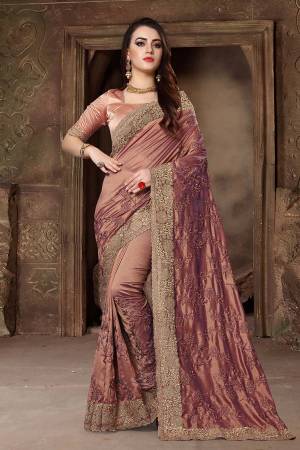 Get Ready For The Upcoming Festive And Wedding Season With This Heavy Designer Saree In Light Brown Color Paired With Light Brown Colored Blouse. This Saree Is Fabricated In Art Silk Paired With Satin Silk Fabricated Blouse. Its Heavy Embroidery And Rich Fabric Will Earn You Lots Of Compliments From Onlookers. 