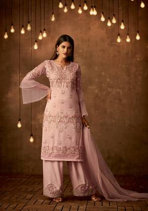 Look Pretty Wearing This Designer Straight Suit In Baby Pink color Paired With Baby Pink Colored Bottom And Dupatta, Its Top And Dupatta Are Net Fabricated Paired With Satin Silk Bottom. Its Fabrics Also Ensures Superb Comfort All Day Long. 