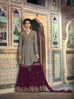 Grab This Beautiful Sharara Suit for You And Your Daughter In Grey Colored Top Paired With Dark Pink Colored Bottom And Dupatta. Its Top And Bottom Are Fabricated On Georgette Paired With Chiffon Fabricated Dupatta. 