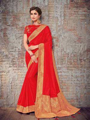 Wear this red and gold color silk fabrics saree. Ideal for party, festive & social gatherings. this gorgeous saree featuring a beautiful mix of designs. Its attractive color and designer heavy design, stone design, silk art and beautiful design all over work over the attire & contrast hemline adds to the look. Comes along with a contrast unstitched blouse.