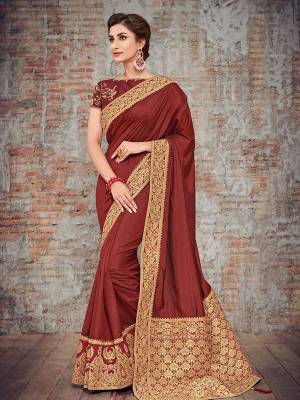marvelously charming is what you will look at the next wedding gala wearing this beautiful maroon color two tone silk fabrics saree. Ideal for party, festive & social gatherings. this gorgeous saree featuring a beautiful mix of designs. Its attractive color and designer heavy design, silk art design and beautiful design all over work over the attire & contrast hemline adds to the look. Comes along with a contrast unstitched blouse.