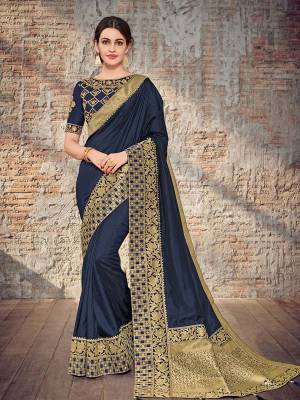 Bring out the best in you when wearing this Navy Blue color two tone silk fabrics saree. Ideal for party, festive & social gatherings. this gorgeous saree featuring a beautiful mix of designs. Its attractive color and designer heavy design, stone design, silk art design and beautiful design all over work over the attire & contrast hemline adds to the look. Comes along with a contrast unstitched blouse.