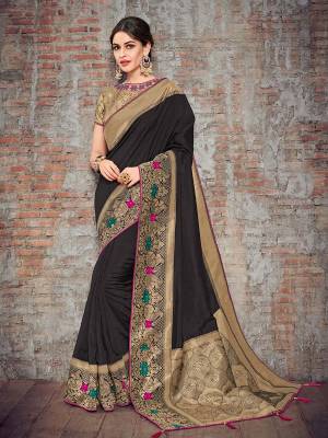 The fabulous pattern makes this saree a classy number to be included in your wardrobe. black and golden color silk fabrics saree. Ideal for party, festive & social gatherings. this gorgeous saree featuring a beautiful mix of designs. Its attractive color and designer heavy design, stone design, silk art design and beautiful design all over work over the attire & contrast hemline adds to the look. Comes along with a contrast unstitched blouse.
