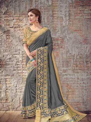 Bring out the best in you when wearing this grey color two tone silk fabrics saree. Ideal for party, festive & social gatherings. this gorgeous saree featuring a beautiful mix of designs. Its attractive color and designer heavy design, stone design, silk art design and beautiful design all over work over the attire & contrast hemline adds to the look. Comes along with a contrast unstitched blouse.