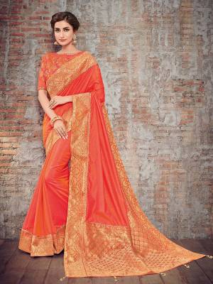 Vibrant and visually appealing, this Orange color two tone silk fabrics saree. Ideal for party, festive & social gatherings. this gorgeous saree featuring a beautiful mix of designs. Its attractive color and designer heavy design, stone design, silk art design and beautiful design all over work over the attire & contrast hemline adds to the look. Comes along with a contrast unstitched blouse.