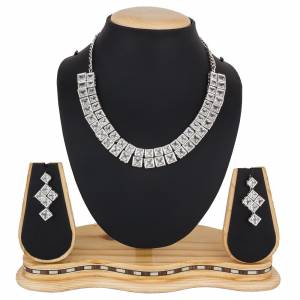 Give A Rich And Elegant Look To Your Neckline With This Designer Necklace Set In Silver Color Beautified With Attractive Stone Work, You Can Pair This Up With Any Colored Indian Or Western Attire. 