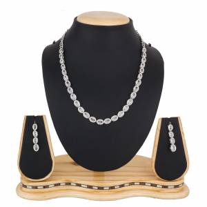 Give A Rich And Elegant Look To Your Neckline With This Designer Necklace Set In Silver Color Beautified With Attractive Stone Work, You Can Pair This Up With Any Colored Indian Or Western Attire. 