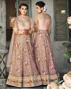 Here Is A Designer Lehenga Choli For The Upcoming Festive And Wedding Season. This Designer Lehenga Choli Can Be Stitched As A Floor Length Suit As Per Your Occasion. Its Blouse Is Fabricated On Art Silk And Net Paired With Oragenza Fabricated Floral Printed Lehenga And Net Fabricated Dupatta. Buy This Now.