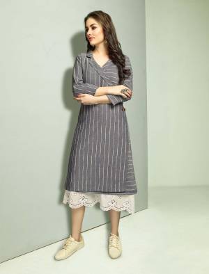 Rich And Elegant Looking Designer Readymade Kurti IS Here In White Colored Top Paired With Grey Colored Jacket. Its Top And Jacket Are Cotton Based And Available In All Sizes. It IS Suitable For Your Semi-Casuals, Festive Wear Or As Formal Wear. Buy Now.