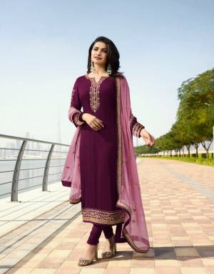 Add This Beautiful Designer Suit To your Wardrobe In Wine Colored Top And Bottom Paired With Powder Pink Colored Dupatta. Its Top Is Fabricated On Georgette Satin Paired With Santoon Bottom And Georgette Fabricated Dupatta. Its Top And Dupatta Are Beautified With Attractive Elegant Embroidery. 