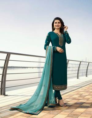 New Shade In Blue Is Here With This Deisgner Straight Suit In Teal Blue Colored Top And Bottom Paired With Pretty blue Colored Dupatta. Its Top Is Fabricated On Georgette Satin Paired With Santoon Bottom And Georgette Dupatta. 