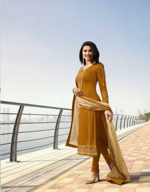 Celebrate This Festive Season With Beauty And Comfort Wearing This Designer Straight Suit In Musturd Yellow Color Paired With Beige Colored Dupatta. Its Top IS Fabricated On Georgette Satin Paired With Santoon Bottom And Georgette Dupatta. Its Pretty Color Pallete And Embroidery Will Earn You Lots Of Compliments From Onlookers. 