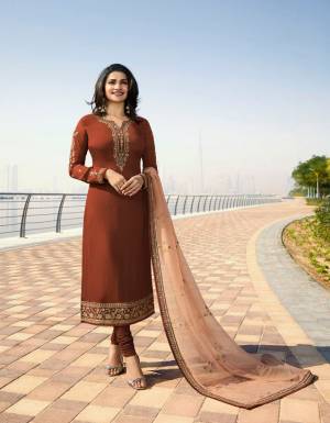 With Some New Color Pallete, Grab This Designer Straight Suit In Brown Color Paired With A Pretty Beige colored Dupatta. Its Top Is Fabricated On Georgette Satin Paired With Santoon Bottom and Georgette Fabricated Dupatta. All Its Fabrics Ensures Superb Comfort All Day Long. 