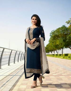 Enhance Your Personality Wearing This Designer Straight Suit In Navy Blue Color Paired With Contrasting Grey Colored Dupatta. Its Top Is Fabricated On Georgette Satin Paired With Santoon Bottom And Georgette Fabricated Dupatta. Its Rich And Elegant Color Combination Will Earn You Lots Of Compliments From Onlookers. 