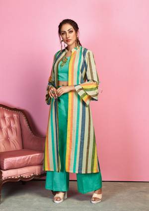 Go Colorful With This Designer Indo Western Dress In Sea Green Colored Crop Top And Pant Paired With Multi Colored Jacket. Its Top And Bottom Are Fabricated On Cotton Satin Paired With Handloom Cotton Fabricated Lining Printed Jacket. 