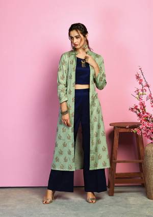 This Festive Season , Look The Most Unique Of All Wearing This Designer Indo-Western Dress In Navy Blue Colored Crop Top And Pant Paired With Light Green Colored Jacket. Its Top And Bottom Are Fabricated On Cotton Satin Paired With Handloom Cotton Jacket. It Is Light In Weight And Ensures Superb Comfort All Day Long. 
