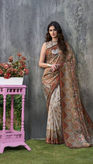Grab This Beautiful Designer Silk Based Saree For The Upcoming Festive Season. This Saree And Blouse Are Fabricated On Tussar Art Silk Beautified With Prints All Over It. Buy Now.