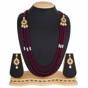 Grab This Very Pretty Pearl Necklace Set In Rani Pink Color Beautified?With Stone Work. You Can Pair This Up With Same Or Any Contrasting Colored Traditional Attire. Buy Now