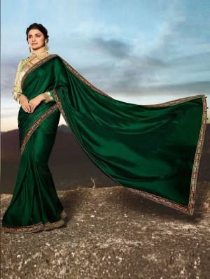 Catch All The Limelight Wearing This Elegant Designer Saree In Dark Green Color Paired With Cream Colored Blouse. This Saree Is Fabricated On Soft Silk Paired With Art Silk Fabricated Blouse. Both Its Fabric Gives A Rich Look To Your Personality. Buy Now.