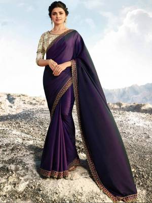 Catch All The Limelight Wearing This Elegant Designer Saree In Dark Purple Color Paired With Cream Colored Blouse. This Saree Is Fabricated On Soft Silk Paired With Art Silk Fabricated Blouse. Both Its Fabric Gives A Rich Look To Your Personality. Buy Now.