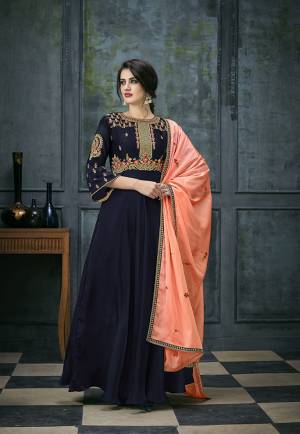 Enhance Your Personality Wearing This Designer Floor Length Suit In Navy Blue Colored Top And Bottom Paired With Contrasting Peach Colored Dupatta. Its Top IS Fabricated On Satin Georgette Paired With Santoon Bottom And Chiffon Dupatta. Buy Now.