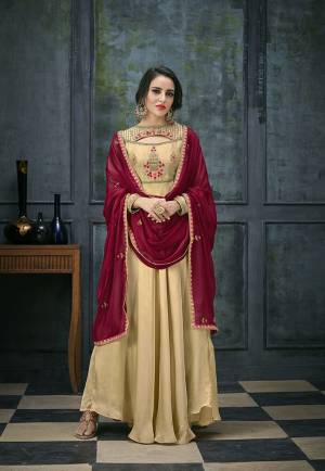 Flaunt Your Rich And Elegant Taste Wearing This Designer Floor Length Suit In Beige Colored Top And Bottom Paired With Maroon Colored Dupatta. Its Top Is Fabricated On Satin Georgette Paired With Santoon Bottom And Chiffon Dupatta. Its Fabrics Ensures Superb Comfort All Day Long. 