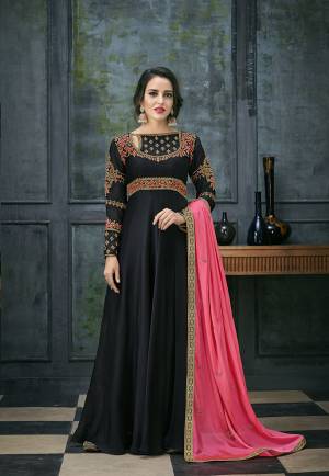 For A Bold And Beautiful Look, Grab This Designer Floor Length Suit In Black Color Paired With Pretty Fuschia Pink Colored Dupatta. Its Top Is Fabricated On Satin Georgette Paired With Santoon Bottom And Chiffon Fabricated Dupatta. Buy Now.