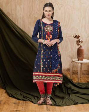 Here Is A Beautiful Embroidered Dress Material In Navy Blue Colored Top and Dupatta Paired With Red Colored Bottom. Its Top And Bottom Are Cotton Based Paired With Chiffon Fabricated Dupatta. Buy Now.
