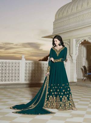 New Shade Is Here To Add Into Your Wardrobe With This designer Floor Length Suit In Teal Green Color Paired With Teal Green Colored Bottom And Dupatta. Its Top And Dupatta Are Georgette Based Paired With Santoon Fabricated Bottom. Buy Now.