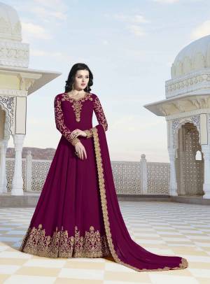 Shine Bright Wearing This Designer Floor Length Suit In Magenta Pink Color Paired With Magenta Pink Colored Bottom And Dupatta, Its Top And Dupatta Are Fabricated On Georgette Paired With Santoon Fabricated Bottom .