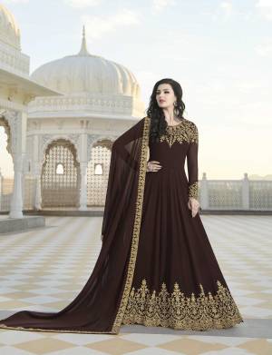 EnhanceYour Personality Wearing This Designer Floor Length Suit In Brown Color Paired With Brown Colored Bottom And Dupatta. Its Top And Dupatta Are Georgette Based Paired With Santoon Fabricated Bottom. 