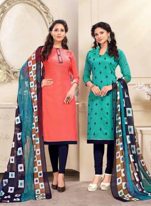 Beautiful Combiantion Is Here With This Dress Material With Two Tops. Its Orange Colored Top Is Cotton Based And Turquoise Blue One Is Chanderi Fabricated Paired With Navy Blue Colored Bottom And Dupatta. Its Attractive Color And Elegant Design Will Earn You Lots Of Compliments From Onlookers. 
