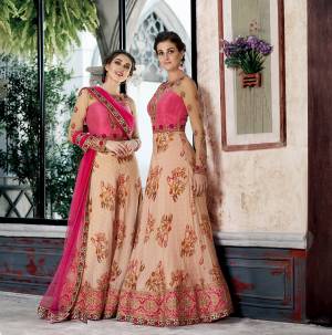 Grab This Designer Two-In-One Lehenga Choli For The Upcoming Festive And Wedding Season. Its Blouse Is Fabricated On Art Silk And Net Paired With Printed Modal Silk And Net Fabricated Dupatta. It Is Beautified With Bold Floral Prints And Attractive Embroidery. Buy Now.