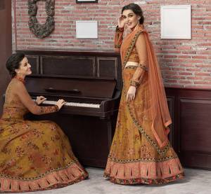 As Per Your Convinince And Occasion, Get This Two-In-One Dress Stitched As Lehenga Or Suit. Its Pretty Blouse Is Fabricated On Art Silk And Net Paired with Modal Silk Fabricated Lehenga And Net Fabricated Dupatta. It Is Beautified With Bold Floral Prints With Embroidery. Also Its Fabrics Ensures Superb Comfort All Day Long. 