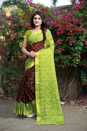 For A Rich And Elegant Look, Grab This Designer Saree With Handicarft Bandhani Print. This Saree And Blouse Are Fabricated On Tafeta Art Silk Which Is Light In Weight And Easy Ro Carry All Day Long. 