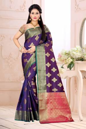 Celebrate This Festive Season Wearing This Saree In Violet Color Paired With Contrsating Pink Colored Blouse. This Saree Is Fabricated On Cotton Silk Paired With Jacquard Silk Fabricated Blouse. It Is Beautified With Weave All Over. 