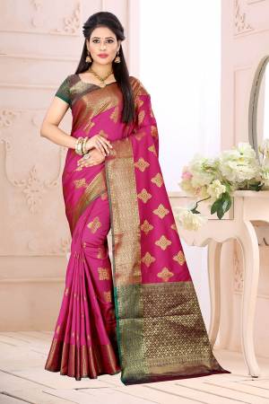 Celebrate This Festive Season Wearing This Saree In Rani Pink Color Paired With Contrsating Purple Colored Blouse. This Saree Is Fabricated On Cotton Silk Paired With Jacquard Silk Fabricated Blouse. It Is Beautified With Weave All Over. 
